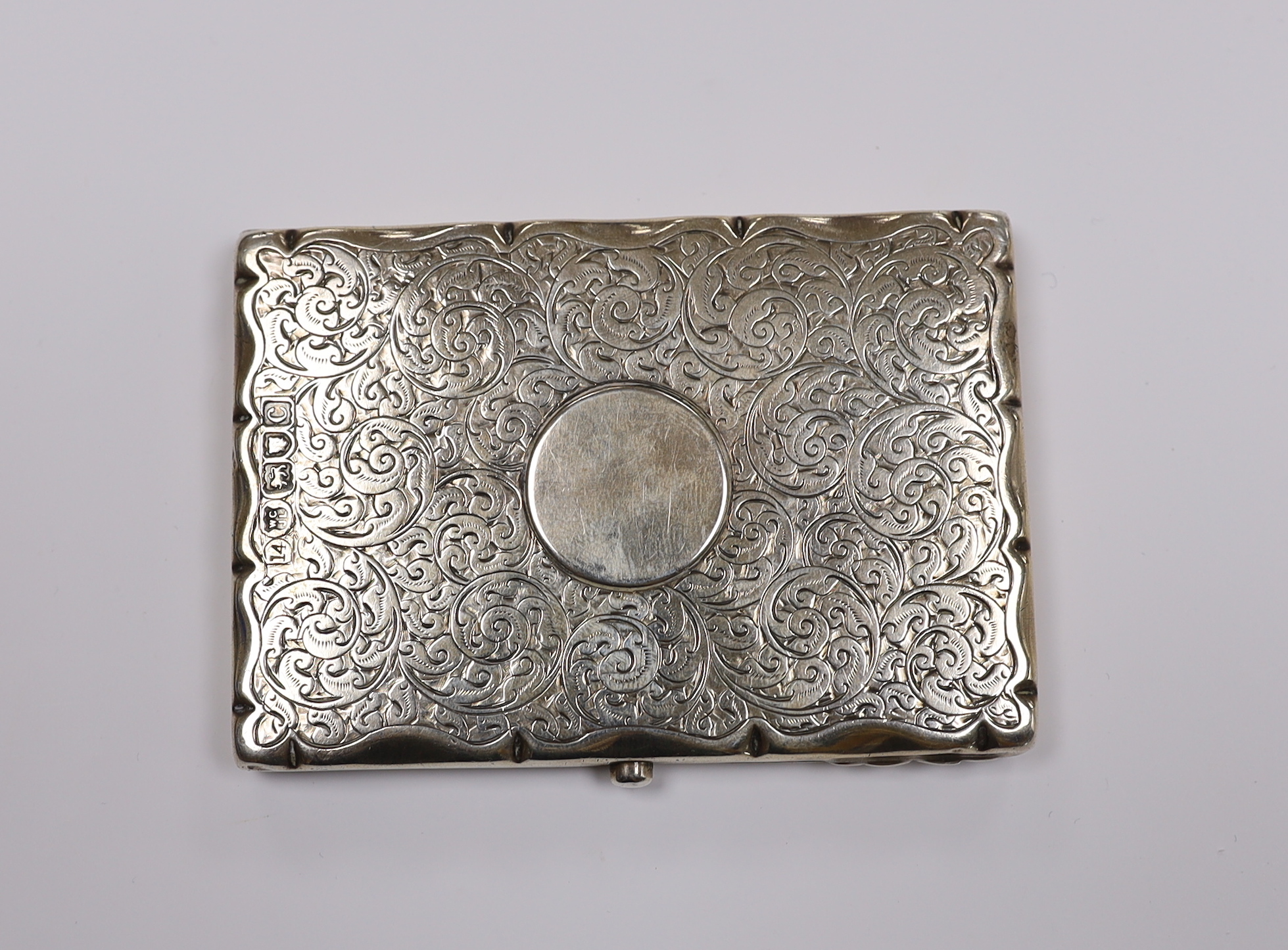 A late Victorian engraved silver mounted card purse, Goldsmiths & Silversmiths Co Ltd, London, 1898, 10.2cm.